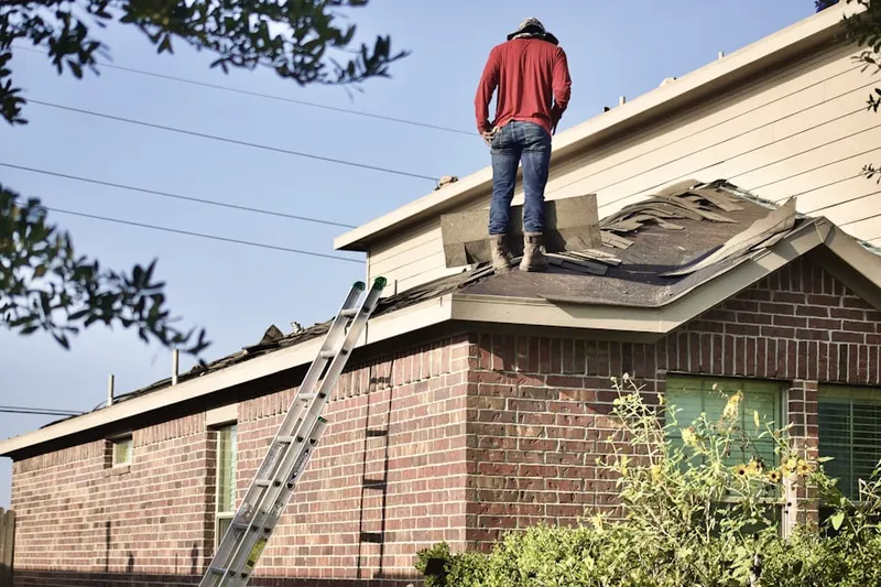Professional roofer working on a residential roof in St. Charles
